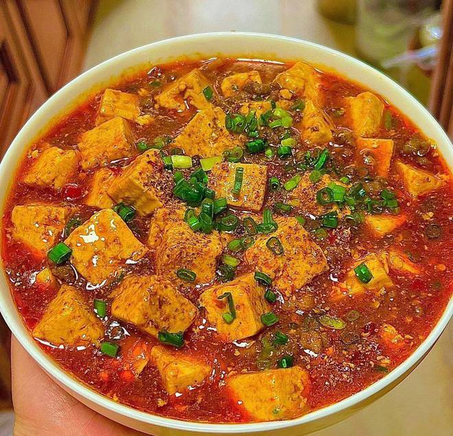 九游娱乐：舌尖上的四川：品味麻婆豆腐的麻辣诱惑(图1)